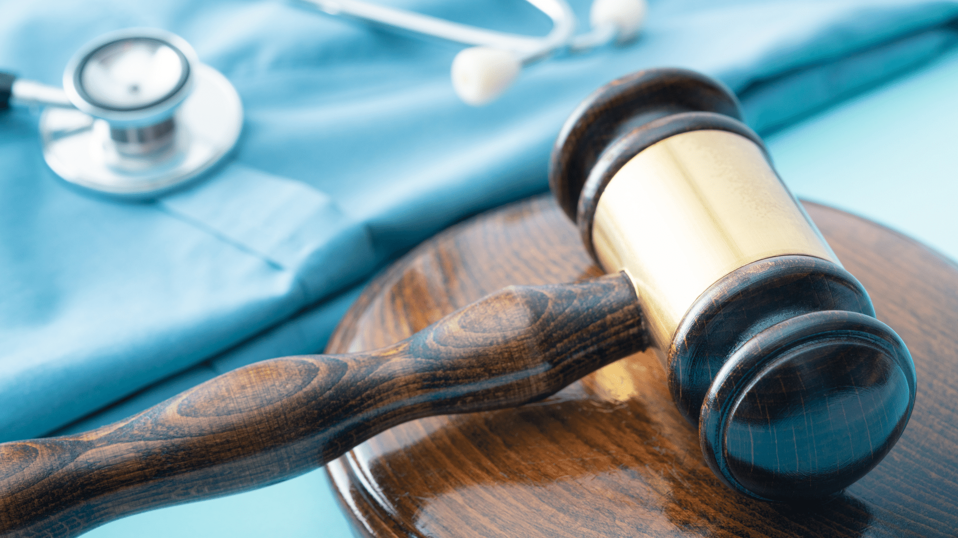 Gavel and stethoscope in background