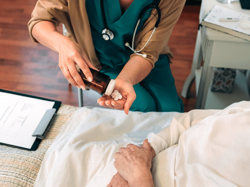 pharmacist administering pills